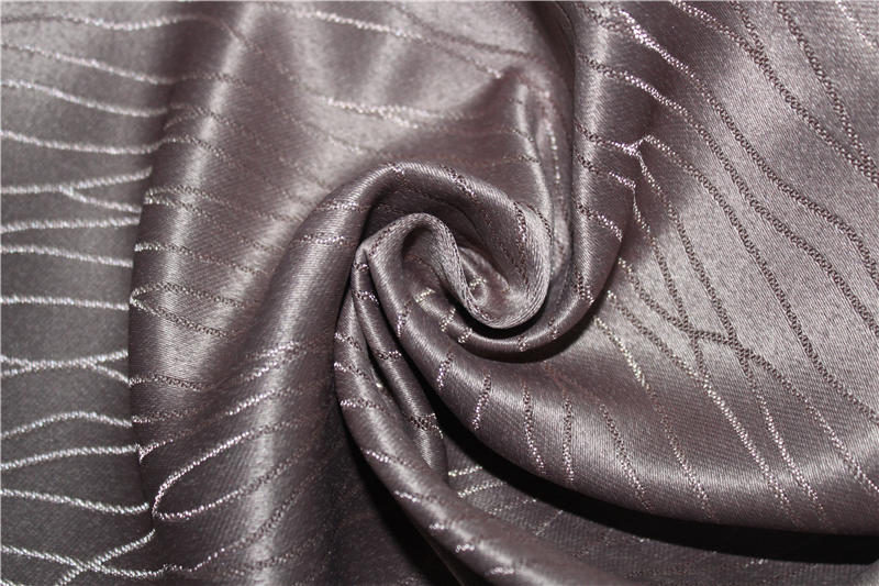 Flame resistant embossed blackout curtain fabric